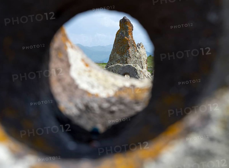 Stone block with hole that allows a view of stones and landscape behind it, stone circle, megaliths, Zorats Karer, Karahundsch, Bronze Age burial ground, Sisian, Sisian, Sjunik province, historical Sangesur, Armenia
