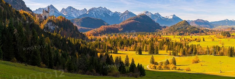Panoramic picture, landscape with green fields, Neuschwanstein Castle and mountains in the background, autumnal atmosphere, Schwangau near Füssen, Ostallgäu, Allgäu, Bavaria, Germany