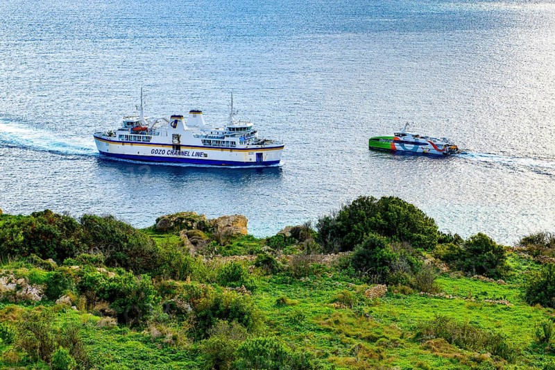 Left car ferry right fast passenger ferry high-speed ferry for passenger traffic Highspeed ferry for crossing the islands of Gozo and Malta, Gozo, Malta