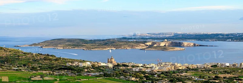 Panoramic view of three islands in the Mediterranean from the state of Malta in front island of Gozo in the middle small island of Comino in the background large island of Malta, Malta
