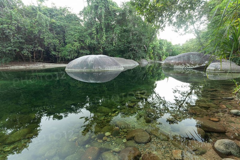 Turquoise blue water between rocks in the Babinda Boulders tropical rainforest in Queensland, Australia