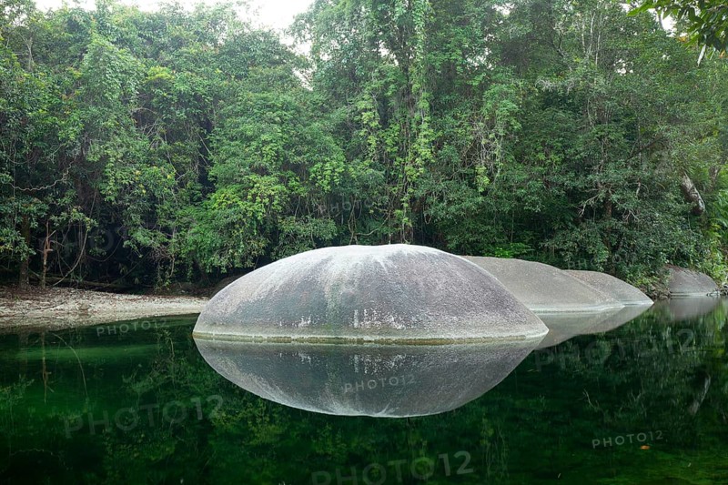 Turquoise blue water between rocks in the tropical rainforest of Babinda Boulders Queensland, Australia