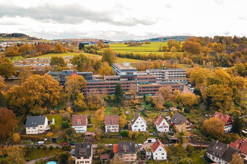 Panoramic view of a small town in an autumnal landscape with surrounding fields, Calw District Office, Calw, Germany