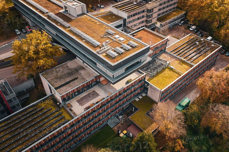 Modern architecture with green roofs and solar cells, nestled in an autumn environment, Calw District Office, Calw, Germany