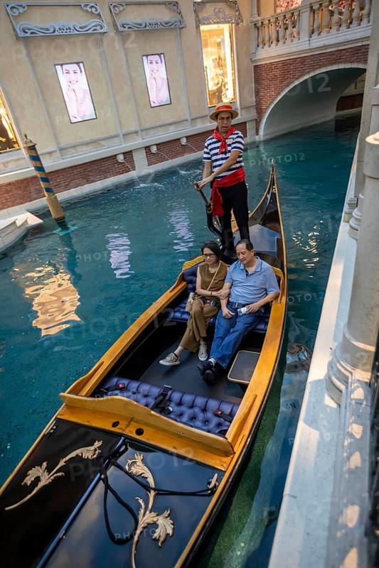 Las Vegas, Nevada - A couple rides on a gondola on the indoor canals at The Venetian Resort
