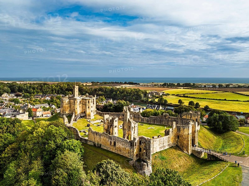 Warkworth Castle over River Coquet from a drone, Warkworth, Northumberland, England, United Kingdom