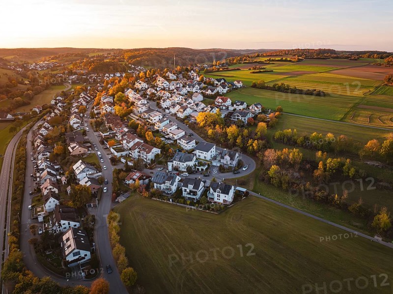 Idyllic landscape at sunset with village and vast fields from a bird's eye view, Deufringen, Aidlingen, Böblingen district, Germany