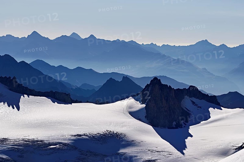 View of the snow-capped mountains from the Aiguille du Midi mountain station observation deck, Chamonix-Mont-Blanc, Haute-Savoie, France