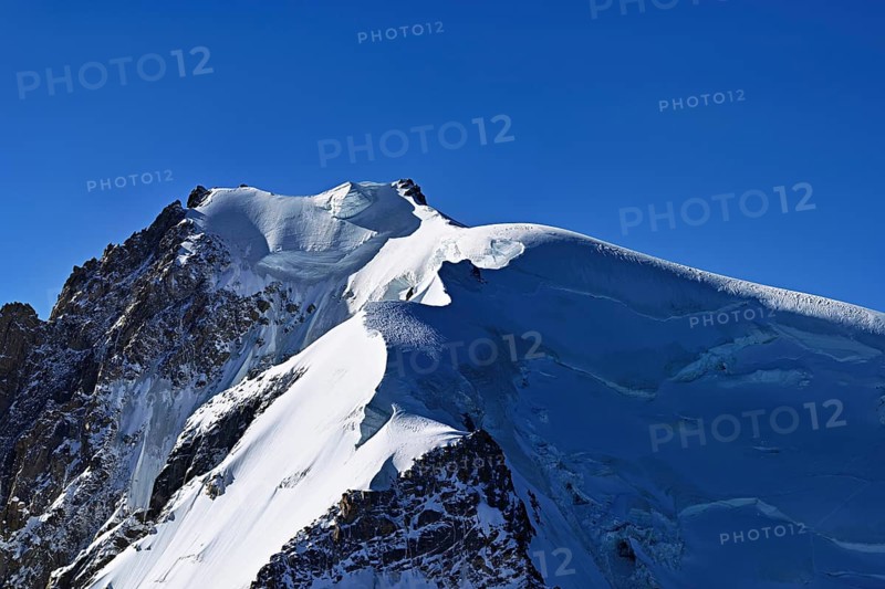 View of the snow-covered Mont Blanc du Tacul from the Aiguille du Midi, Chamonix-Mont-Blanc, Haute-Savoie, France