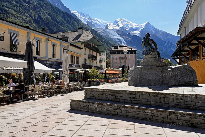 Statue of Michel-Gabriel Paccard, Savoyard doctor and mountaineer, in the back the Mont-Blanc mountain range, Chamonix-Mont-Blanc, Haute-Savoie, France