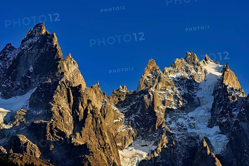 Mountains from the left, Aiguille de Blaitière, Dent du Caïman, Dent du Crocodile, Aiguille du Plan, in the light of the setting sun, Chamonix-Mont-Blanc, Haute-Savoie, Italy Watershed, France