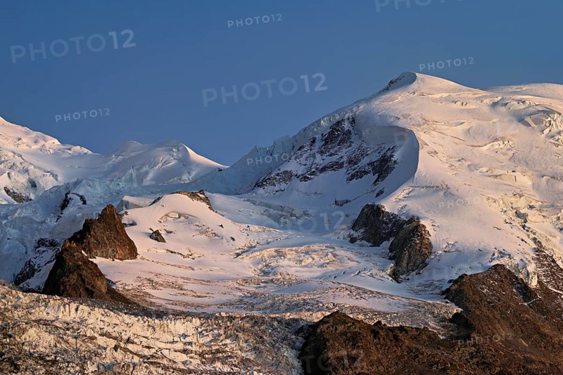 Snow-covered Dome du Goûter, in the evening light, Chamonix-Mont-Blanc, Haute-Savoie, France
