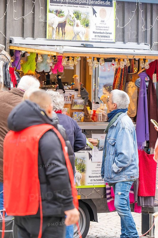 People in front of a market stand selling clothes and accessories, Streuobstmarkt, Sindelfingen, Böblingen district, Germany