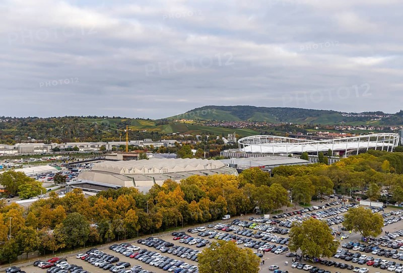Neckarpark Stuttgart with Hanns-Martin-Schleyer-Hall and MHP Arena. Cars parked on the Wasen fairground. Stuttgart, Baden-Württemberg, Germany