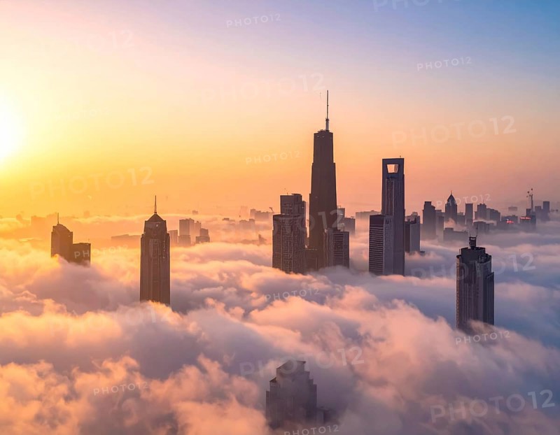 City scape emerging from a dense enveloping fog in sunrise and skyscrapers piercing the haze, big metropolis with skyline, mist on ground, blue sky, city in an aerial view, AI generated