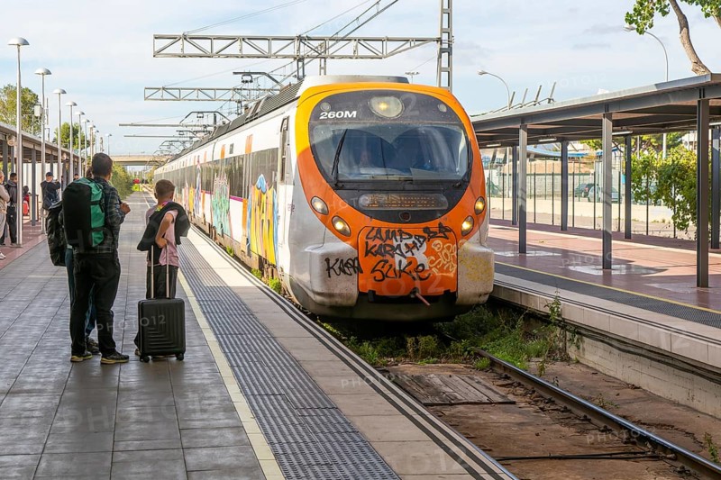 Renfe Civia commuter train at platform of Airport railway station, Rodalia de Barcelona suburban rail network, Barcelona, Catalonia, Spain