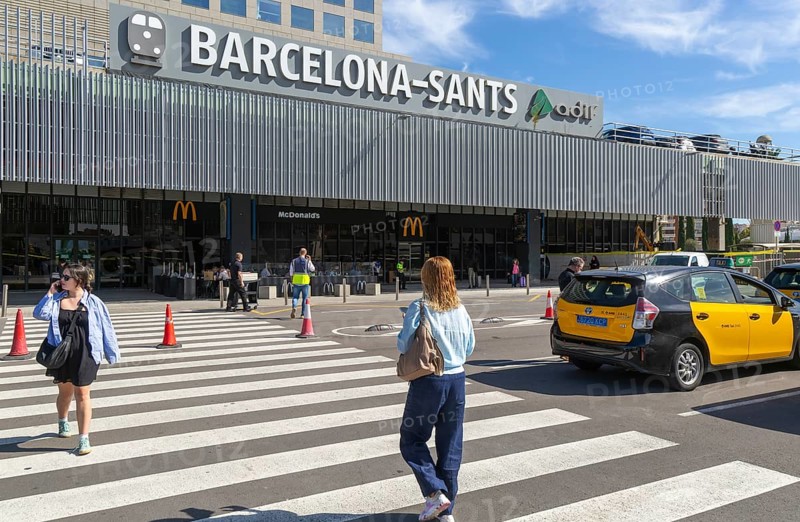 Taxis in street outside Barcelona-Sants railway station building in city centre, Barcelona, Catalonia, Spain