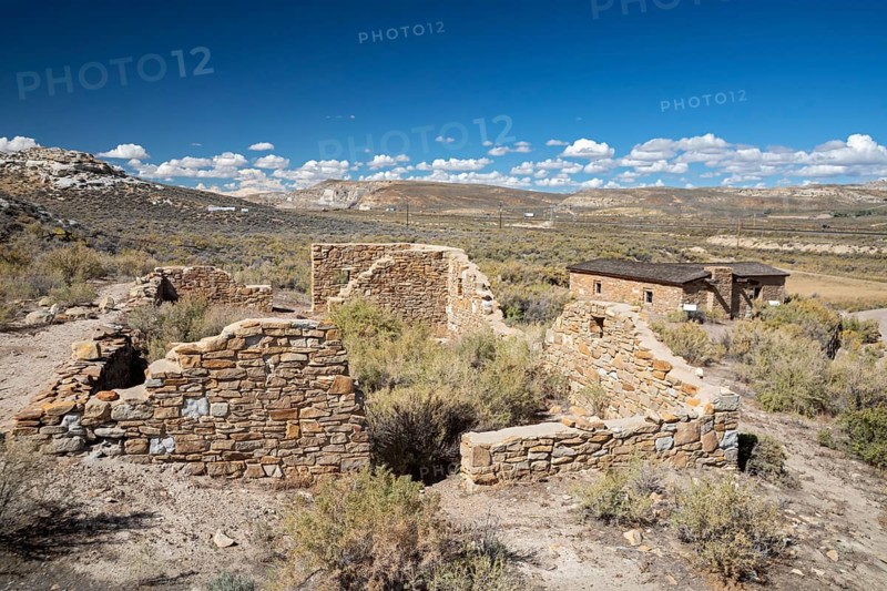 Rock Springs, Wyoming - The Point of Rocks Stagecoach Station, built in 1862 on the Overland Trail. The ruins of the stables are in the foreground, with the roofed station beyond. The station was operated by the Overland Stage Company and later by Wells Fargo