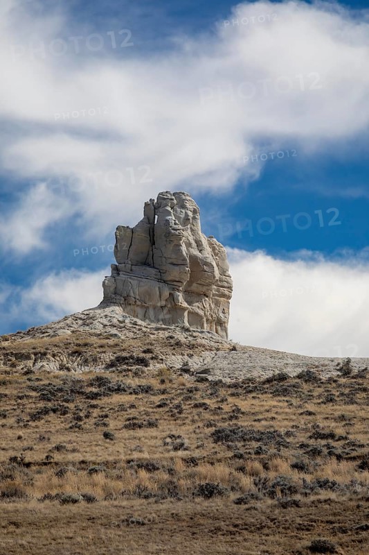 Midwest, Wyoming - Teapot Rock, for which Teapot Dome was named. The Teapot Dome oil field, and two other sites in California, were part of a major bribery scandal during the Warren Harding administration in 1922. The 'handle' and 'spout' on the rock teapot tell off in 1930 and 1962