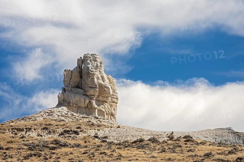 Midwest, Wyoming - Teapot Rock, for which Teapot Dome was named. The Teapot Dome oil field, and two other sites in California, were part of a major bribery scandal during the Warren Harding administration in 1922. The 'handle' and 'spout' on the rock teapot tell off in 1930 and 1962