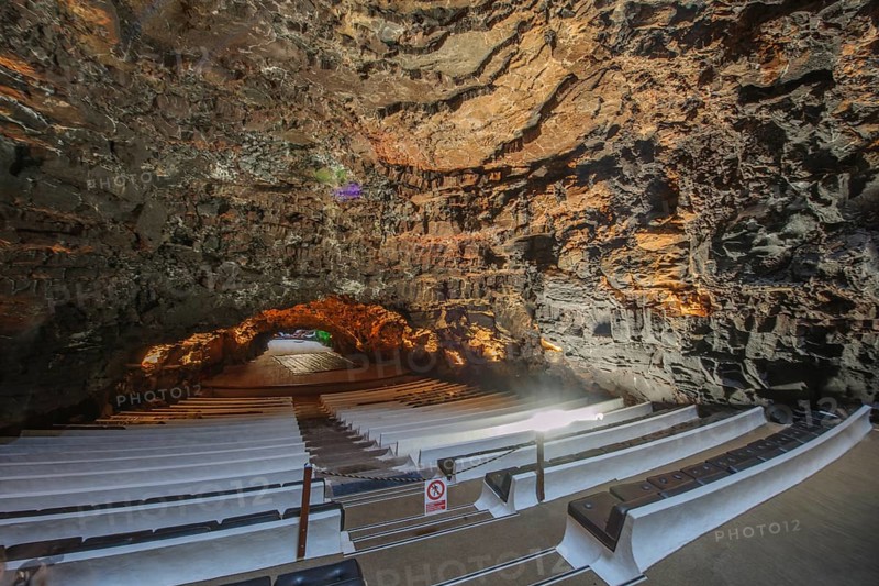 Los Jameos concert hall designed by César Manrique as a tourist attraction in lava cave of cave system in Jameos del Agua cultural center, lava tunnel in the background, Punta Mujeres, Lanzarote, Canary Islands, Spain