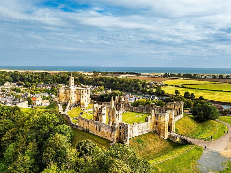 Warkworth Castle over River Coquet from a drone, Warkworth, Northumberland, England, United Kingdom
