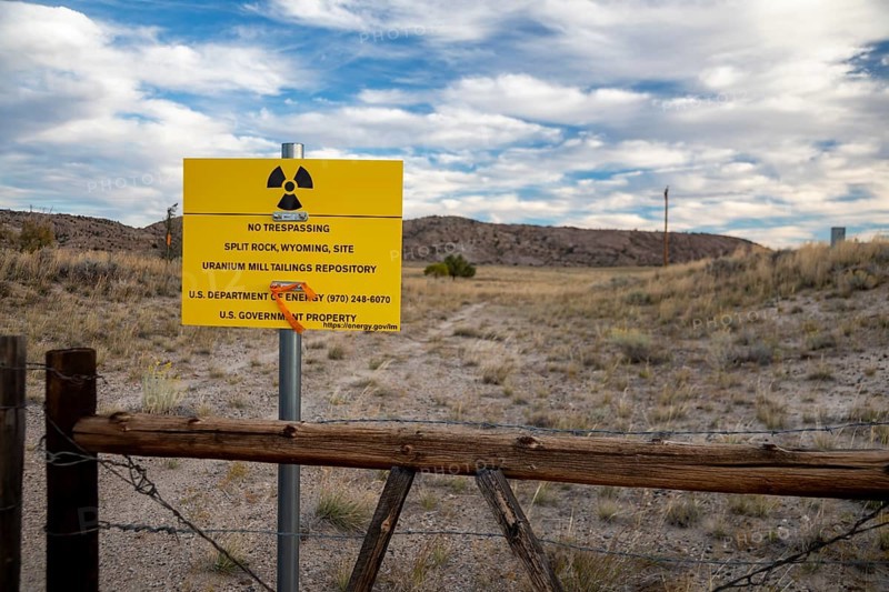 Jeffrey City, Wyoming - 'No Trespassing' signs adorn the perimeter of a former uranium mine and mill which operated from 1957 until 1981. Uranium tailings and other radioactive debris have been buried and the site is now under the care of the Department of Energy
