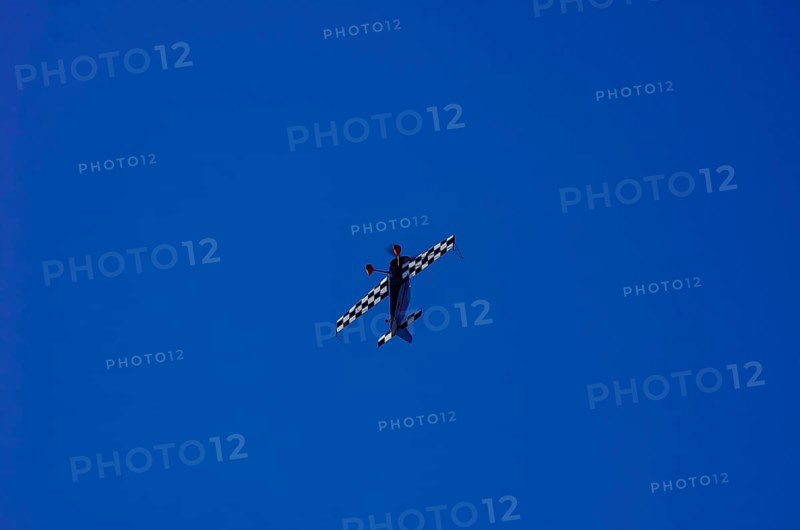 A single-engine aerobatic aircraft during a flight demonstration at the Rossfeld Luftsportverein in Rossfeld in Metzingen-Glems, Baden-Württemberg, Germany, for editorial use only