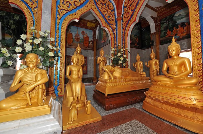 Prayer room devotional room with golden statues from left Monk and Buddha in the temple complex Wat Chalong Pilgrimage Site, Wat Chaithararam, Phuket Province, Phuket Island, Thailand
