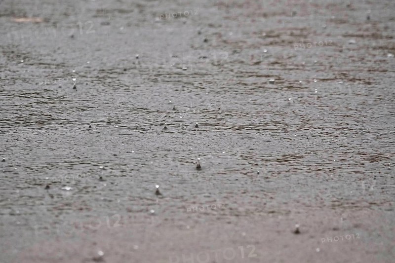 Raindrops falling on a lake, autumn, Germany