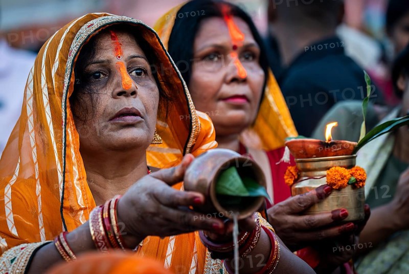 Hindu devotees offer prayers to the Sun God on the bank of Brahmaputra river on the occasion of Chhath Puja, in Guwahati, India on 27 October 2025
