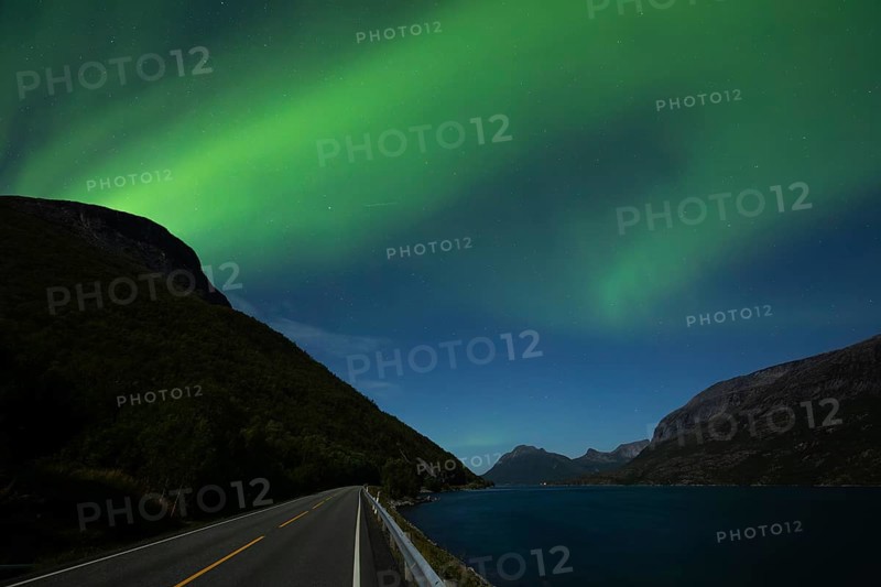 Tysfjord near Stetind Mountain in northern Norway under auroras and full moon