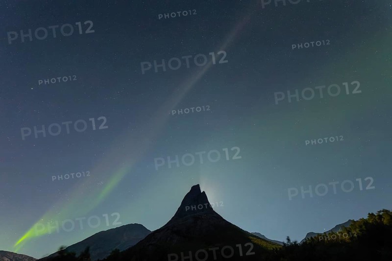National mountain of Norway - Stetind in the Nordland under auroras and a full moon