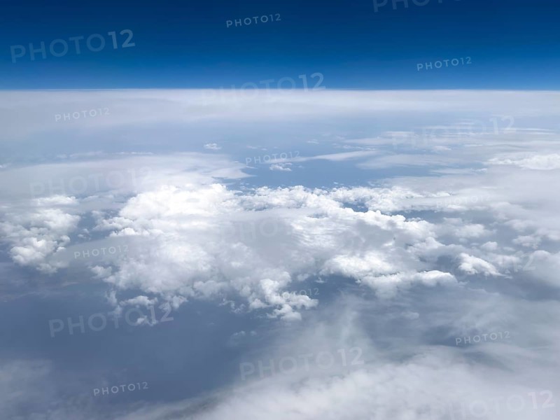 View from airplane of white bright cluster clouds Cirrus cirrus clouds, international
