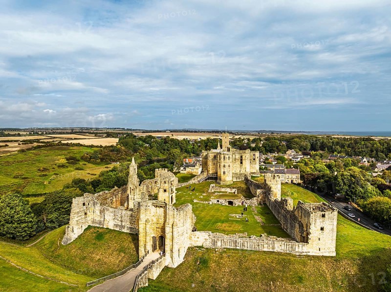 Warkworth Castle over River Coquet from a drone, Warkworth, Northumberland, England, United Kingdom