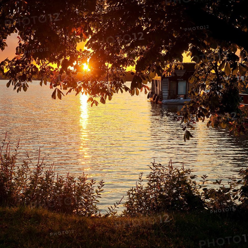 Atmospheric sunset over Lake Gudelack, Lindow (Mark), Stechlin-Ruppiner Land nature park Park, Brandenburg, Germany