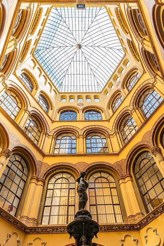 Donaunix fountain and glass dome in Palais Ferstel, Vienna, Austria