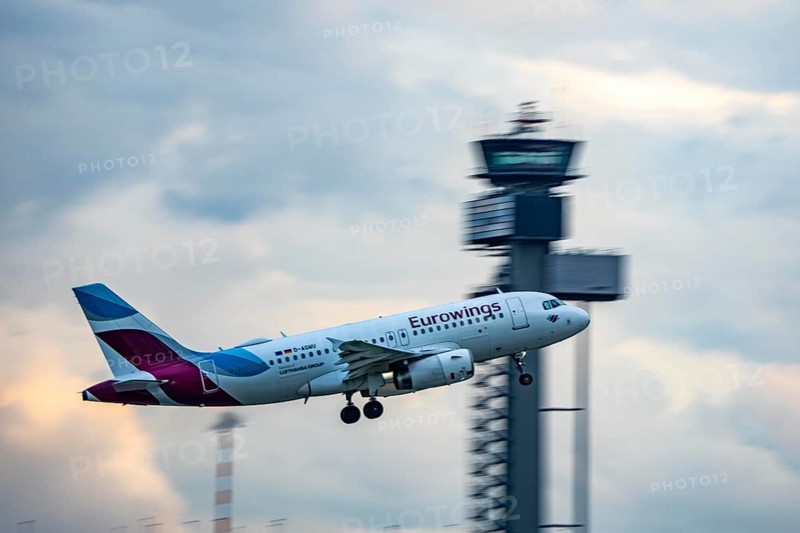 Eurowings Airbus A319 taking off from Düsseldorf Airport, Air Traffic Control Tower, North Rhine-Westphalia, Germany