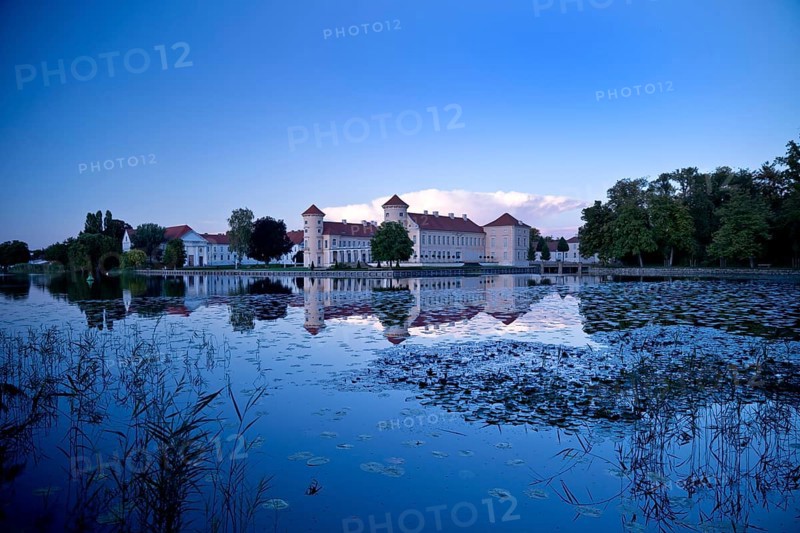 Rheinsberg Castle, lakeside with Lake Grienerick at night, prime example of Friederician Rococo, Brandenburg, Germany