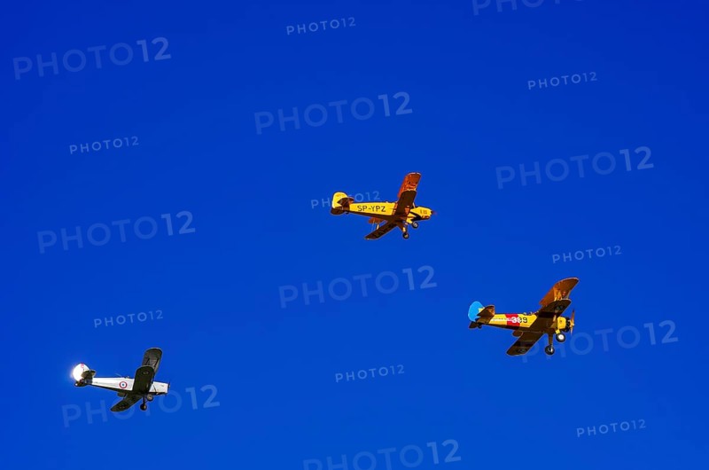 Three biplanes, a Boeing PT-17 Stearman, a Stampe-Vertongen SV-4B and a Bücker Bue 131 Jungmann fly in formation as part of an air show on Rossfeld in Metzingen-Glems, Baden-Württemberg, Germany, for editorial use only
