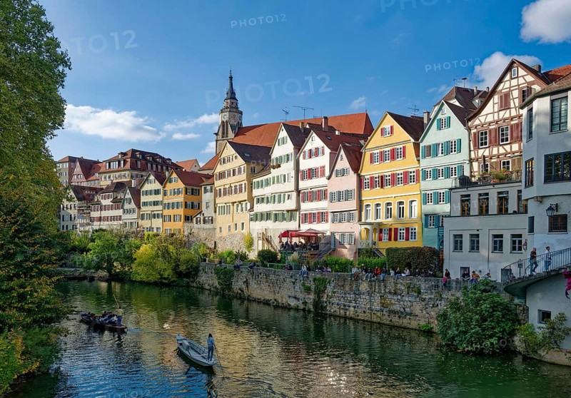 Historic houses on the Neckar front, the Neckar river with poking and water reflection, old town of Tübingen, Baden-Württemberg, Germany