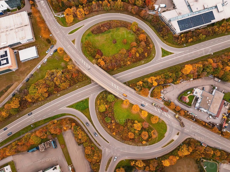 Modern road network with roundabout and autumn trees from an aerial perspective, Dornstetten, Freudenstadt district, Germany
