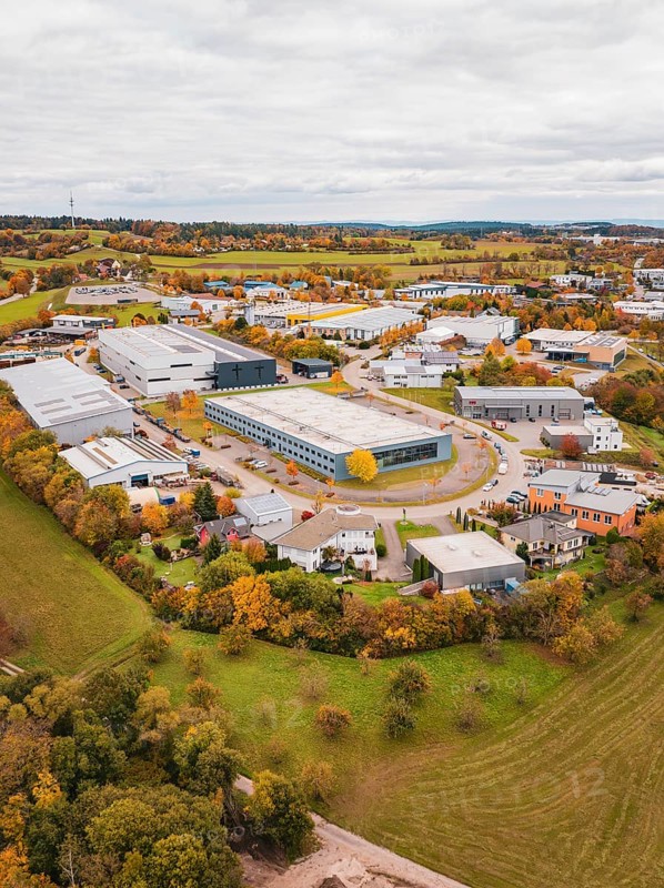 Large industrial area in autumn surroundings, bird's-eye view of houses and fields, Dornstetten, Freudenstadt district, Germany