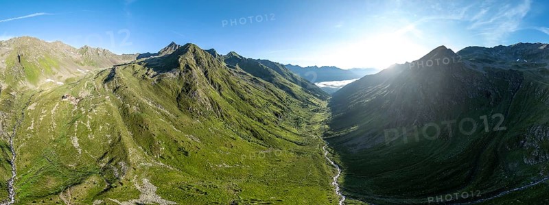 Alpine panorama, aerial view, Lasörlinghütte mountain hut in evening light, mountain landscape with alpine roses, Lasörling Group, Hohe Tauern, East Tyrol, Austria