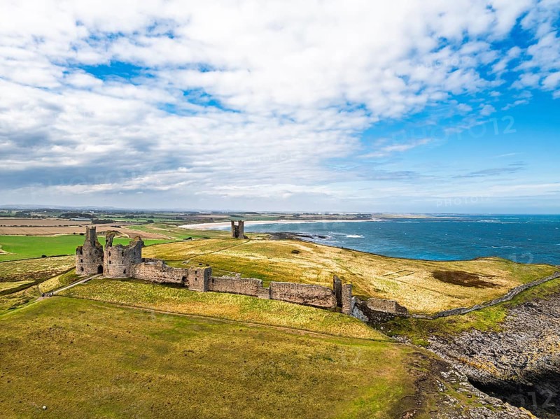 Dunstanburgh Castle from a drone, Northumberland Coast, England, United Kingdom