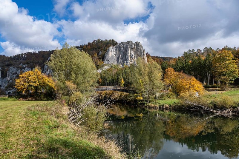 Wooden bridge across the Danube in the Upper Danube Valley, surrounded by autumn vegetation, Sigmaringen district, Baden-Württemberg, Germany