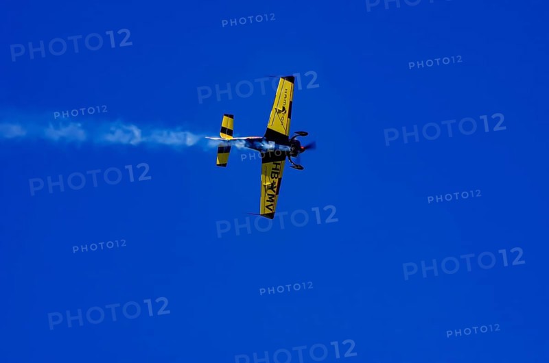 A Votec 351 sport aircraft from the Swiss MSW Aviation AG with registration HB-YMV during a flight demonstration as part of an air show on Rossfeld in Metzingen-Glems, Baden-Württemberg, Germany, for editorial use only