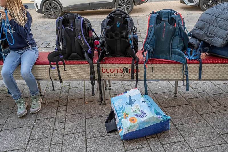 Students waiting for the bus, school bags left on a bench, Bavaria, Germany
