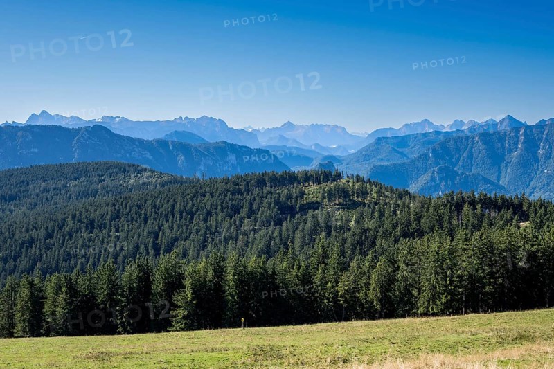 View from Stoisser Alm in Chiemgau of the Berchtesgaden and Chiemgau Alps and the wooded Teisenberg in the foreground, Bavaria, Germany