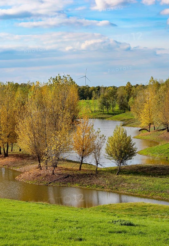 Wesel, Lower Rhine, North Rhine-Westphalia, Germany - autumn on the Lippe, trees with colorful autumn leaves in the restored river floodplain area of Büdericher Insel above the mouth of the Lippe into the Rhine, Lippe estuary nature reserve